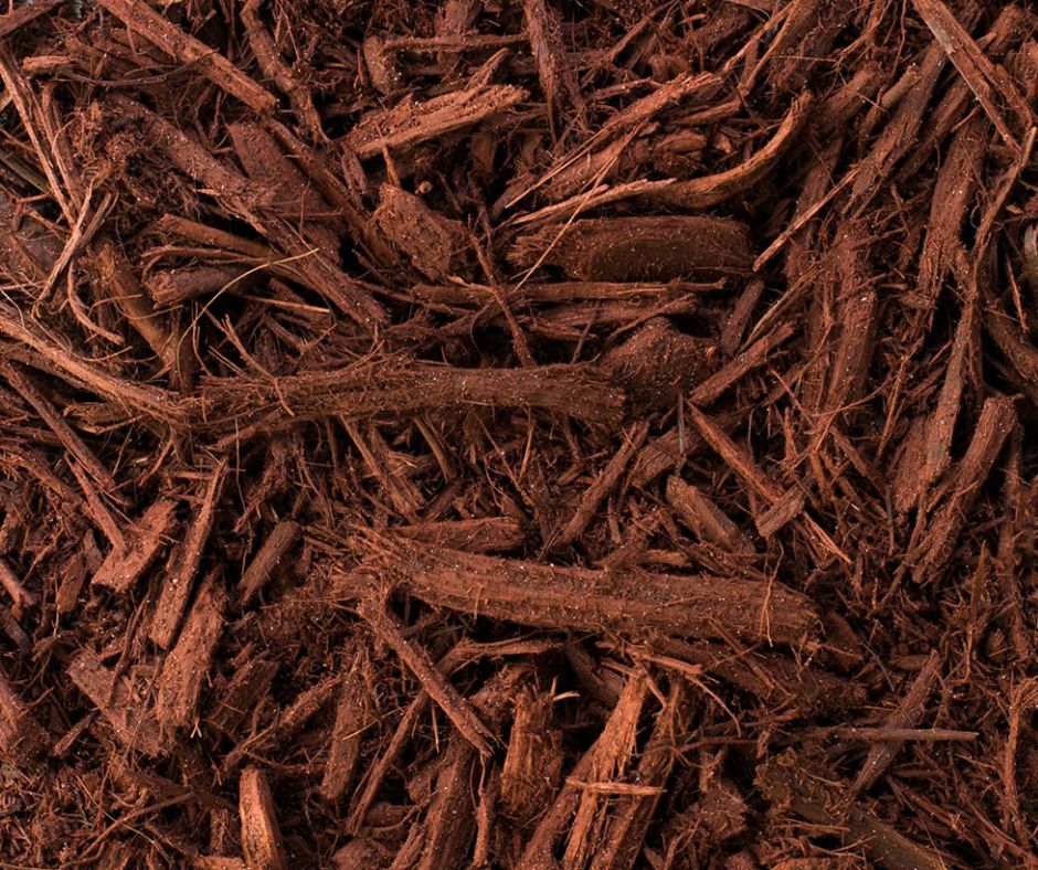 Red hardwood mulch covering the ground